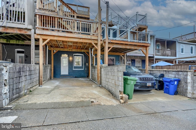 exterior space with a carport and brick siding