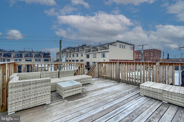 wooden deck with an outdoor living space