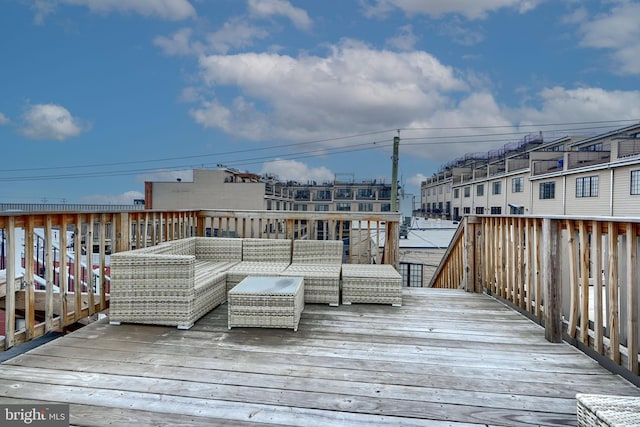 wooden terrace featuring an outdoor hangout area