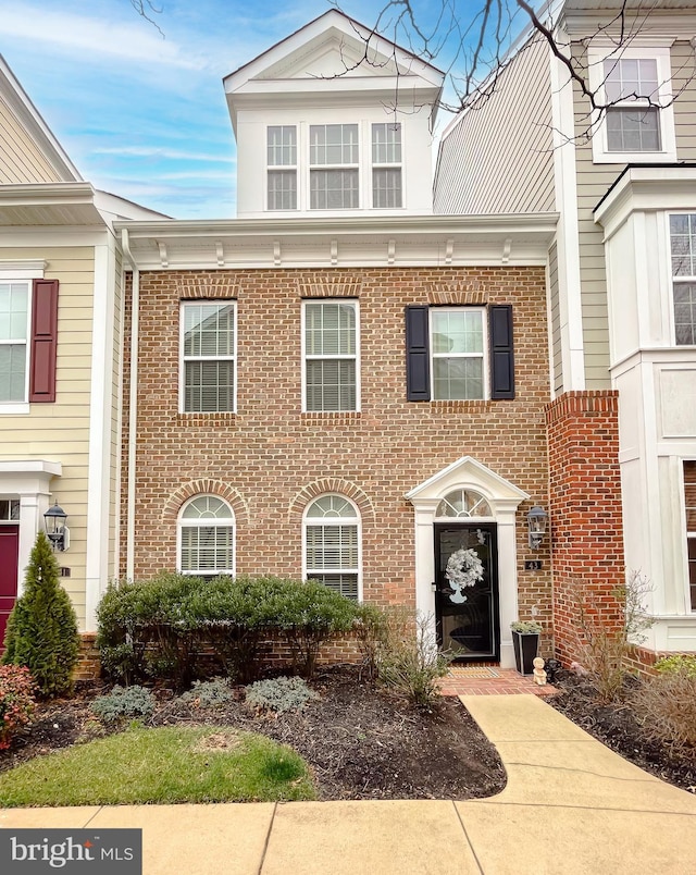 view of front of home with brick siding