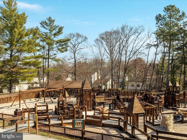 surrounding community with a deck and playground community