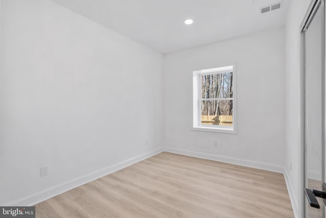 unfurnished room with recessed lighting, visible vents, baseboards, and light wood-style floors