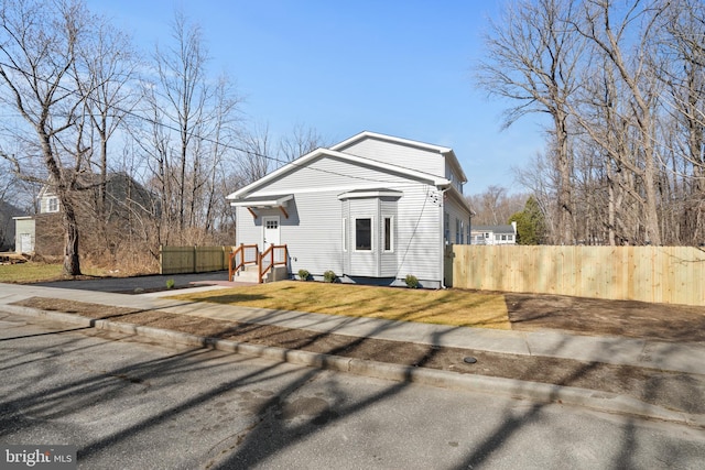 view of front of house with fence