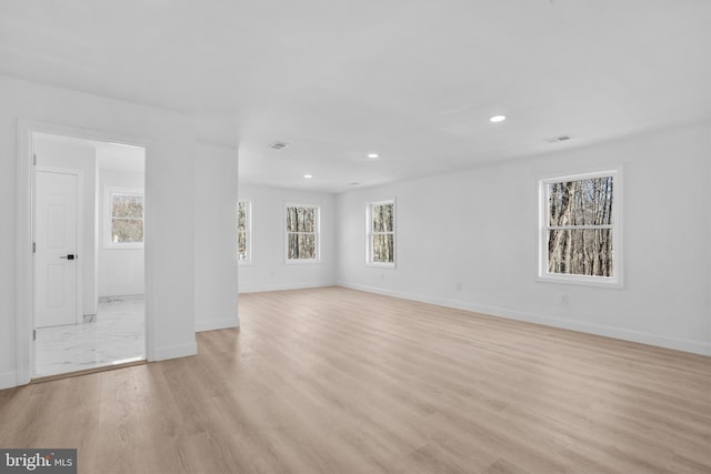 unfurnished room featuring recessed lighting, visible vents, baseboards, and light wood finished floors