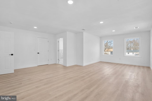 unfurnished living room featuring visible vents, recessed lighting, baseboards, and light wood finished floors