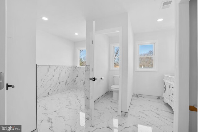 bathroom with vanity, visible vents, recessed lighting, toilet, and marble finish floor