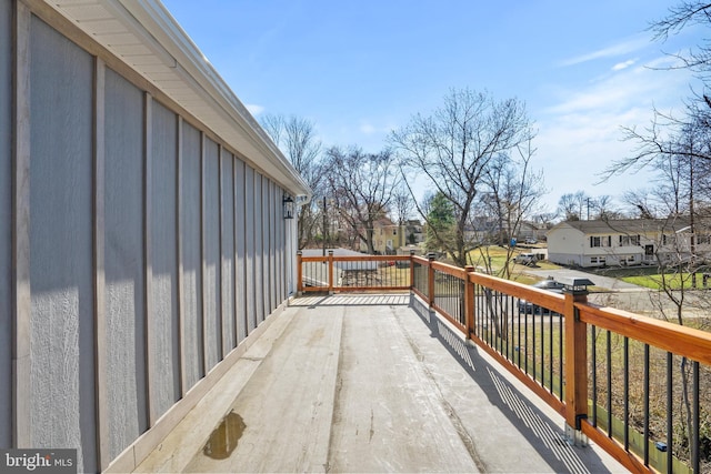 wooden terrace with a residential view