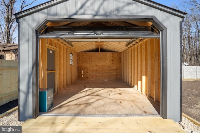 exterior space featuring an outdoor structure and fence