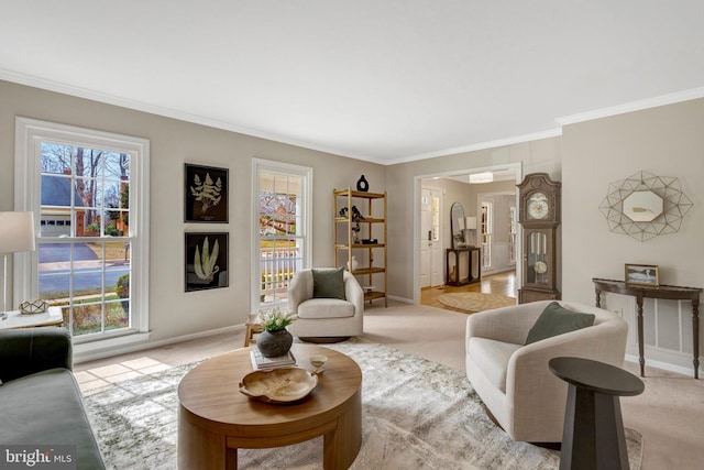 living area with ornamental molding, light carpet, and baseboards