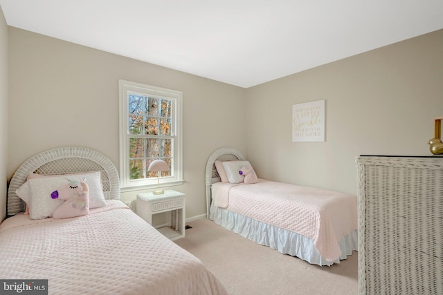 bedroom featuring carpet flooring and baseboards