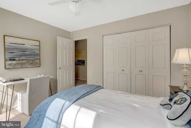 bedroom featuring carpet, ceiling fan, and a closet