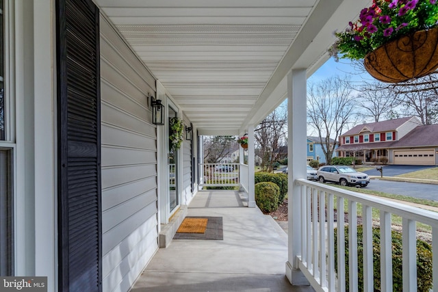 view of patio with a residential view and covered porch