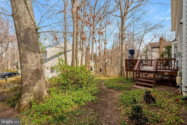 view of yard with a wooden deck