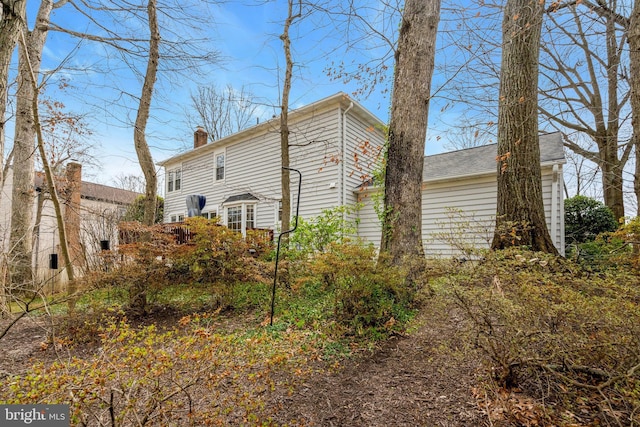 view of home's exterior featuring a chimney