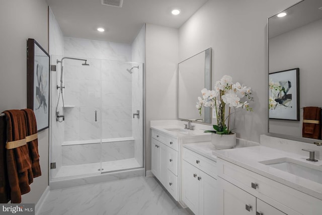 full bathroom featuring recessed lighting, marble finish floor, vanity, and a marble finish shower