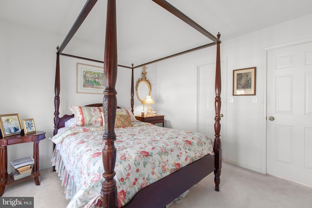 bedroom with baseboards and carpet flooring