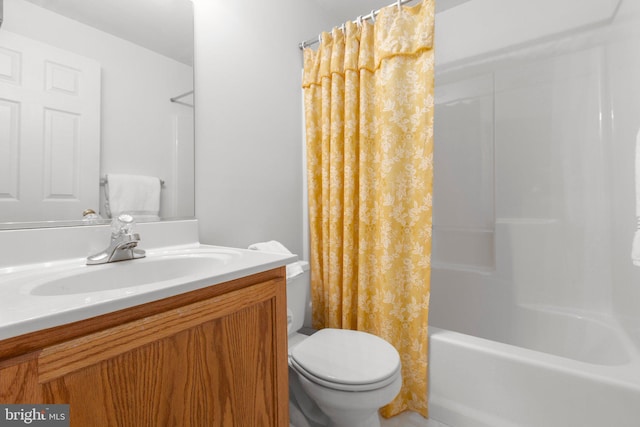 bathroom featuring toilet, vanity, and shower / bath combination with curtain