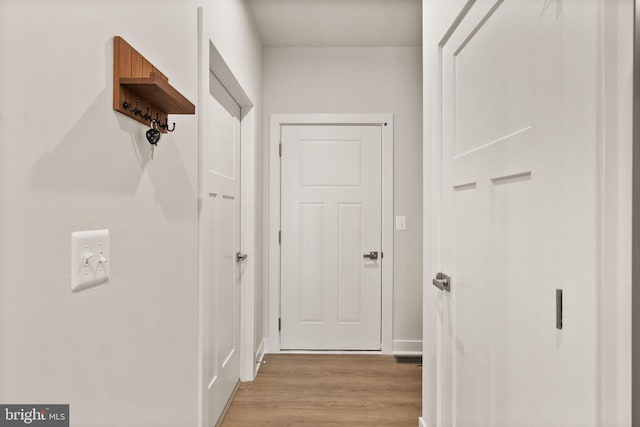 hall featuring light wood-style flooring