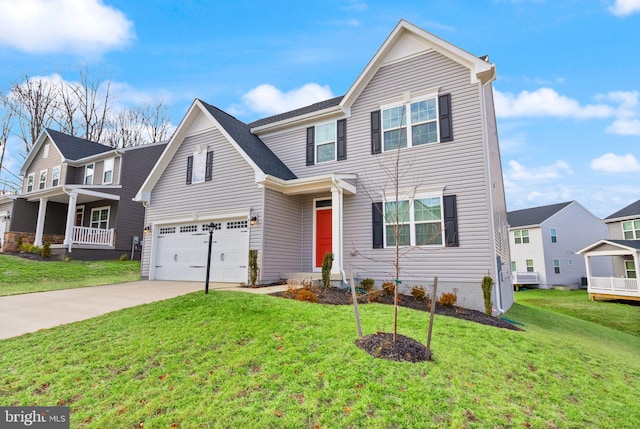 traditional-style home featuring a front yard, concrete driveway, and an attached garage