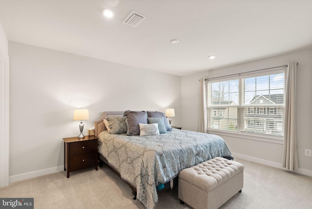 bedroom featuring recessed lighting, visible vents, light carpet, and baseboards