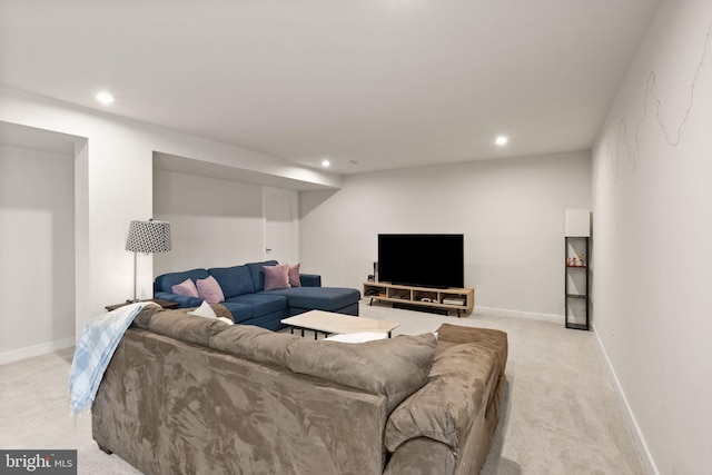 living room featuring recessed lighting, baseboards, and light colored carpet