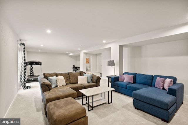 living room with baseboards, light colored carpet, and recessed lighting