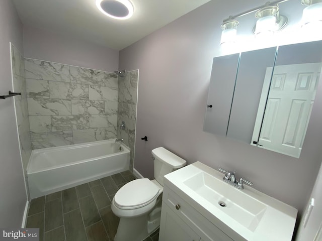 bathroom featuring shower / bathing tub combination, vanity, and toilet