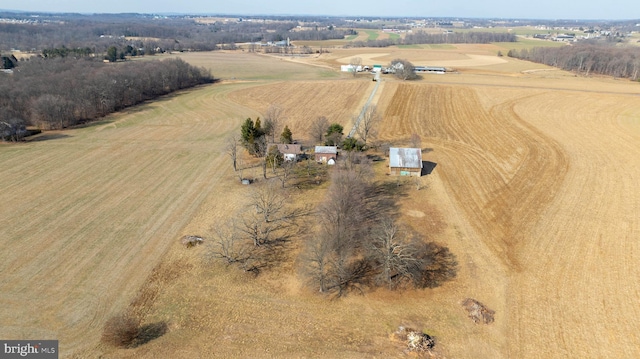 birds eye view of property with a rural view