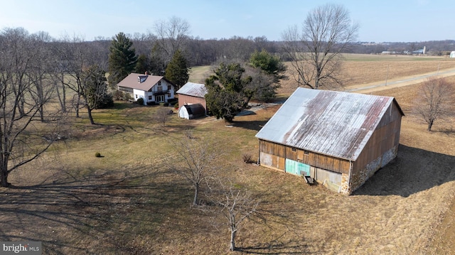 birds eye view of property featuring a rural view