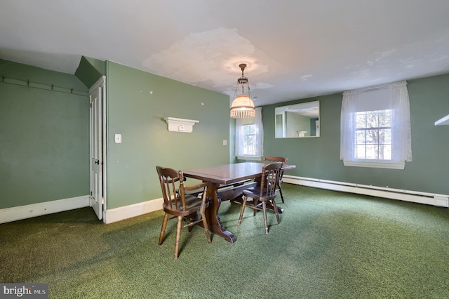 dining space featuring a baseboard heating unit, carpet floors, and baseboards