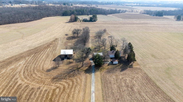 birds eye view of property with a rural view