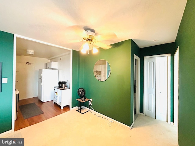 interior space featuring ceiling fan