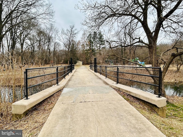 surrounding community with a water view