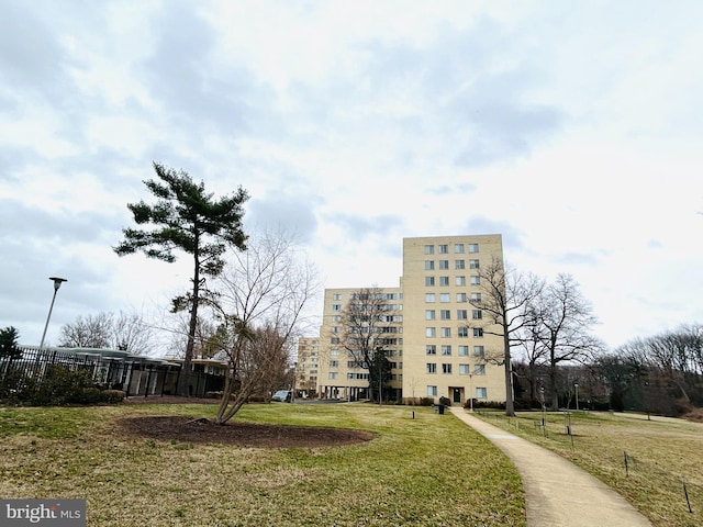 view of building exterior with fence