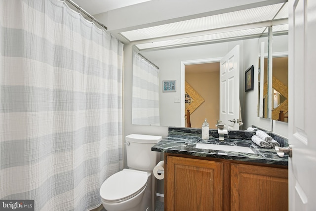 full bath with toilet and vanity