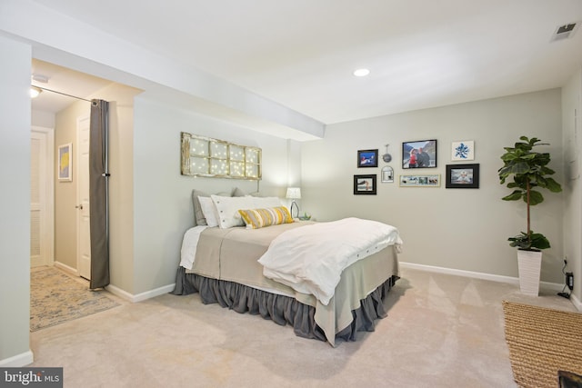 carpeted bedroom with recessed lighting, visible vents, and baseboards