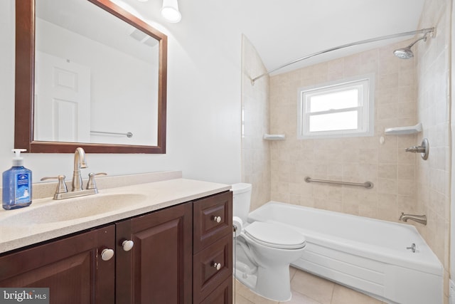 bathroom featuring bathing tub / shower combination, vanity, toilet, and tile patterned floors