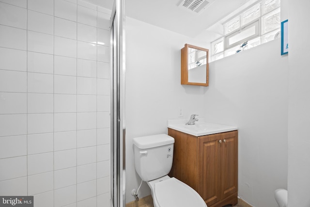 bathroom with toilet, a stall shower, and visible vents