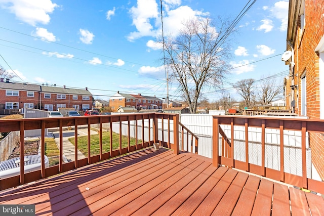 wooden terrace with a residential view