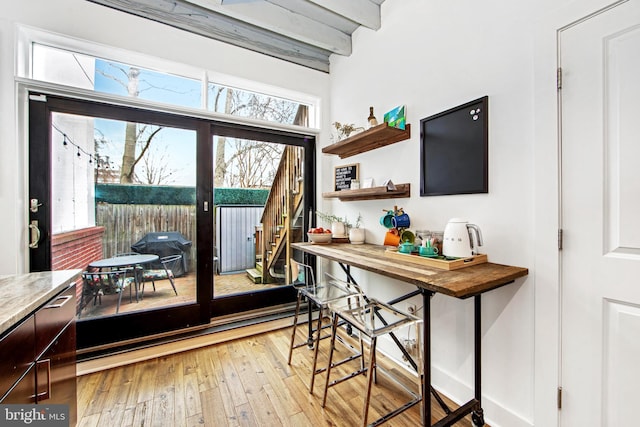 entryway with a baseboard radiator and hardwood / wood-style flooring