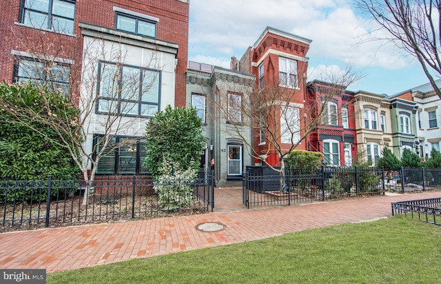 view of property featuring a fenced front yard