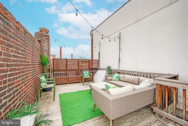 wooden deck featuring an outdoor hangout area