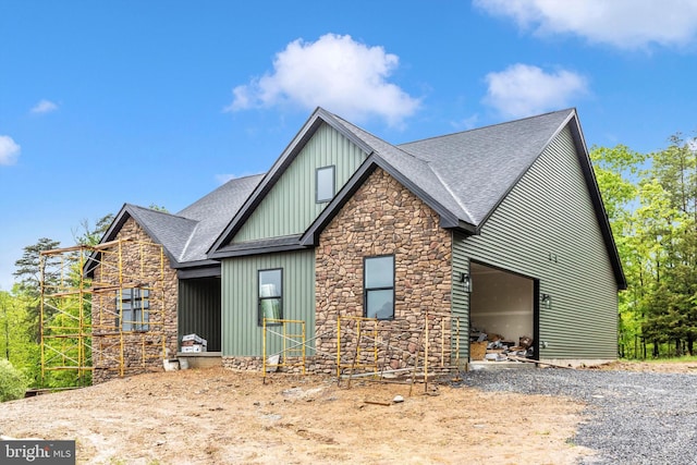 103 Husk Trl, Berkeley Springs, WV 25411 - view of front facade featuring roof with shingles, stone siding, and board and batten siding