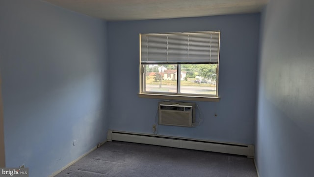 spare room featuring carpet, a baseboard radiator, and a wall mounted AC