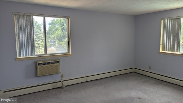 empty room with a baseboard radiator, a wall mounted air conditioner, and carpet flooring