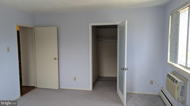 unfurnished bedroom with light colored carpet, a baseboard radiator, an AC wall unit, and multiple windows