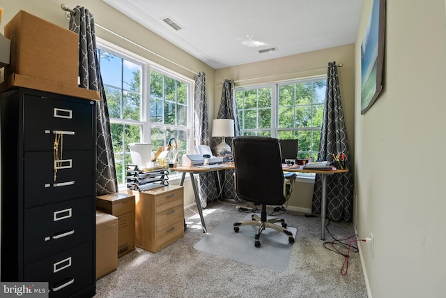 office space with visible vents and baseboards