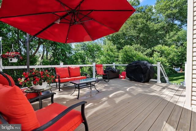 wooden terrace featuring grilling area and outdoor lounge area