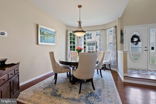 dining room with dark wood-style floors and baseboards