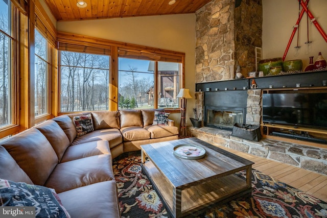 living room featuring recessed lighting, a fireplace, wood ceiling, and lofted ceiling